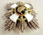 The Order of the Holy Crown brest star with swords and war decoration